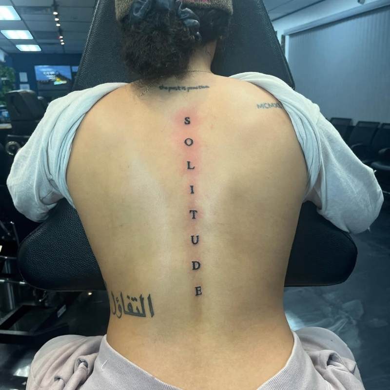 spine tattoos words