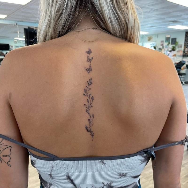 flower spine tattoo