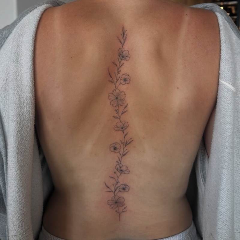spine flower tattoos