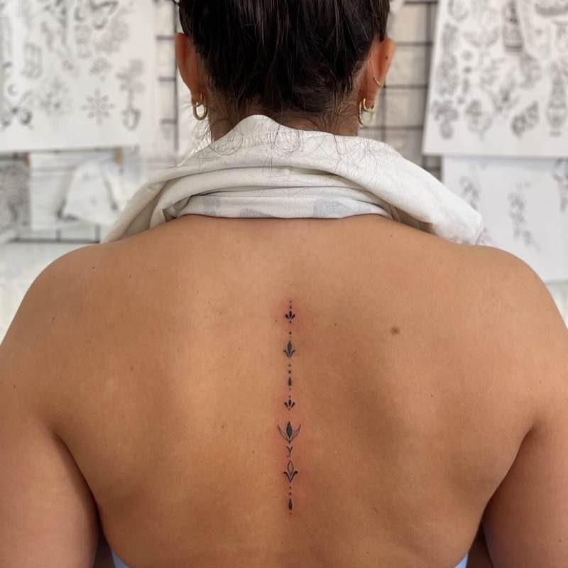 feminine spine tattoos